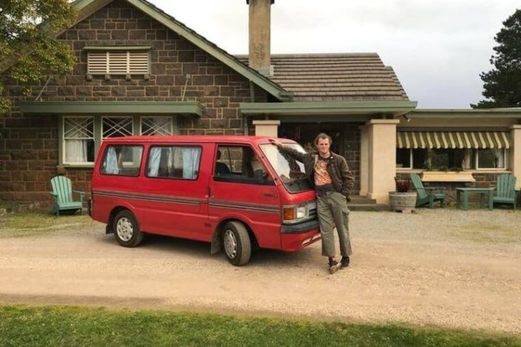 A Man Posing With His Van
