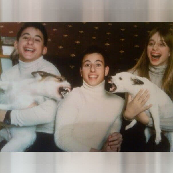 Three Happy Children and Two Angry Dogs