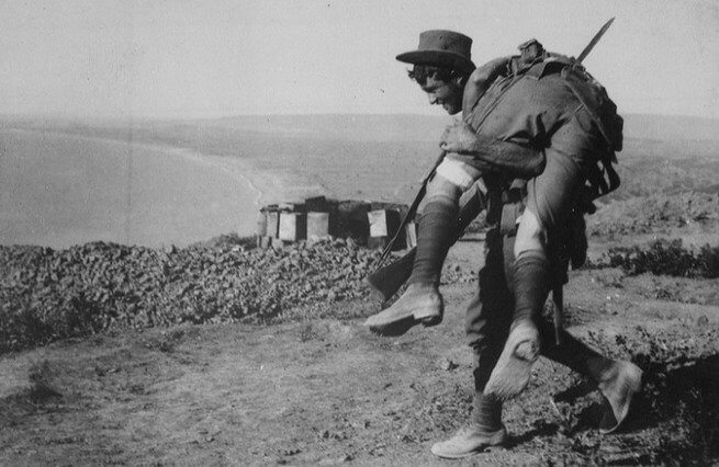 Australian Soldier Carries Comrade During World War II