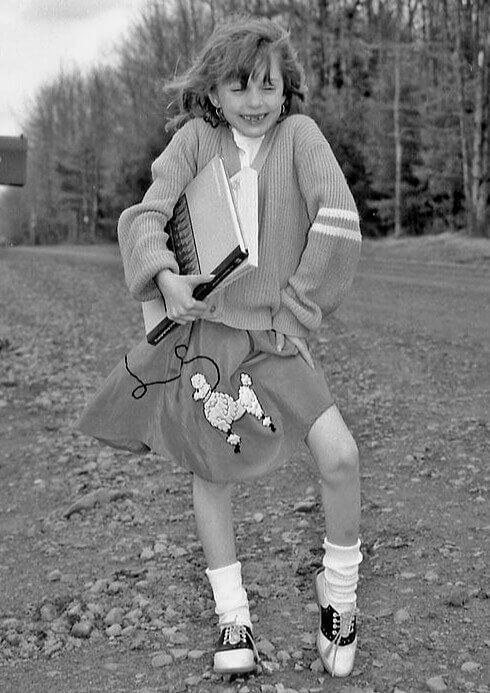 The 1950s "Poodle Skirt": Why We All Carried Dogs on Our Hips