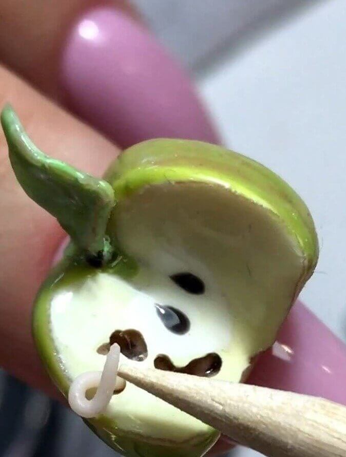 This Green Apple Has a Worm In It