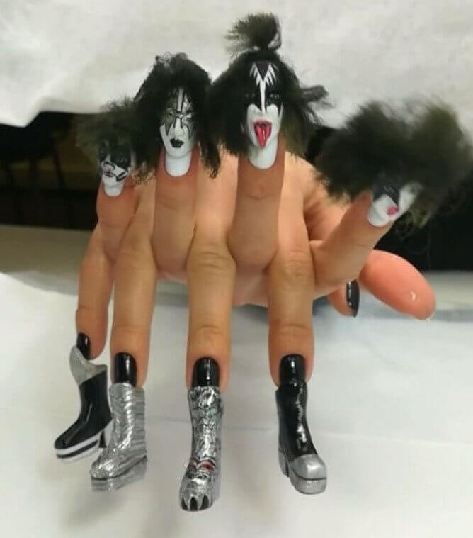 The Entire Band of Kiss on Two Hands