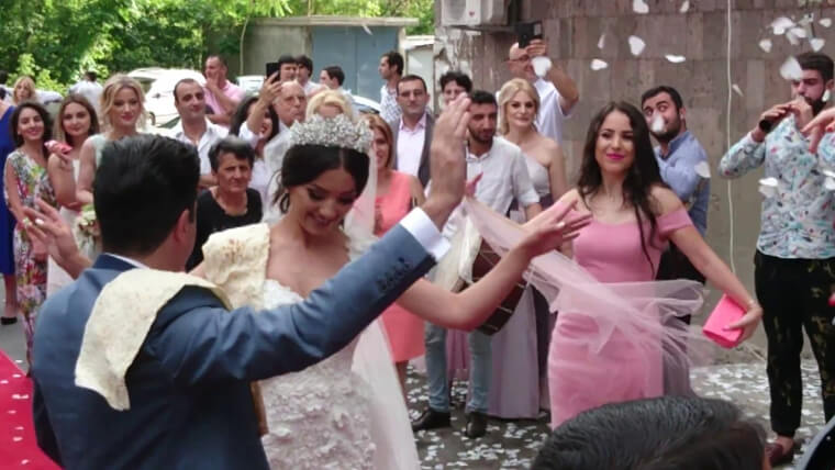 Armenian Brides and Grooms Balance Bread on Their Shoulders to Ward off Bad Spirits