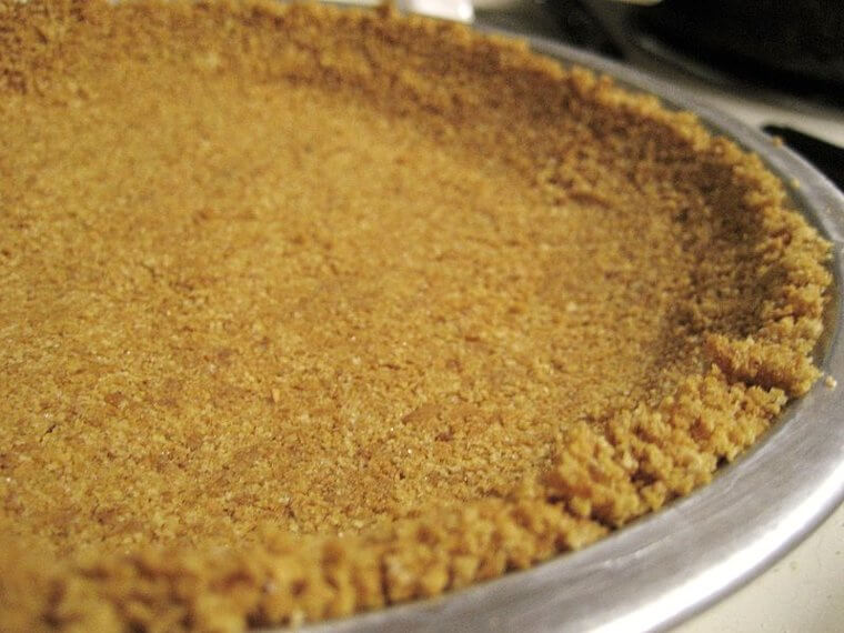 Coat a Cake Pan With Crushed Graham Crackers