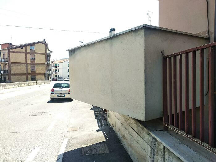 Floating Wall Wonder: Anyone Walking on the Sidewalk Must Duck Down or End up Looking Like a Cartoon Character