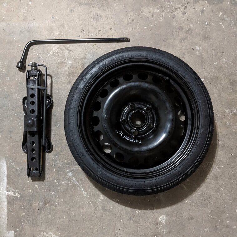 A Spare Tire, Jack and Lug Wrench