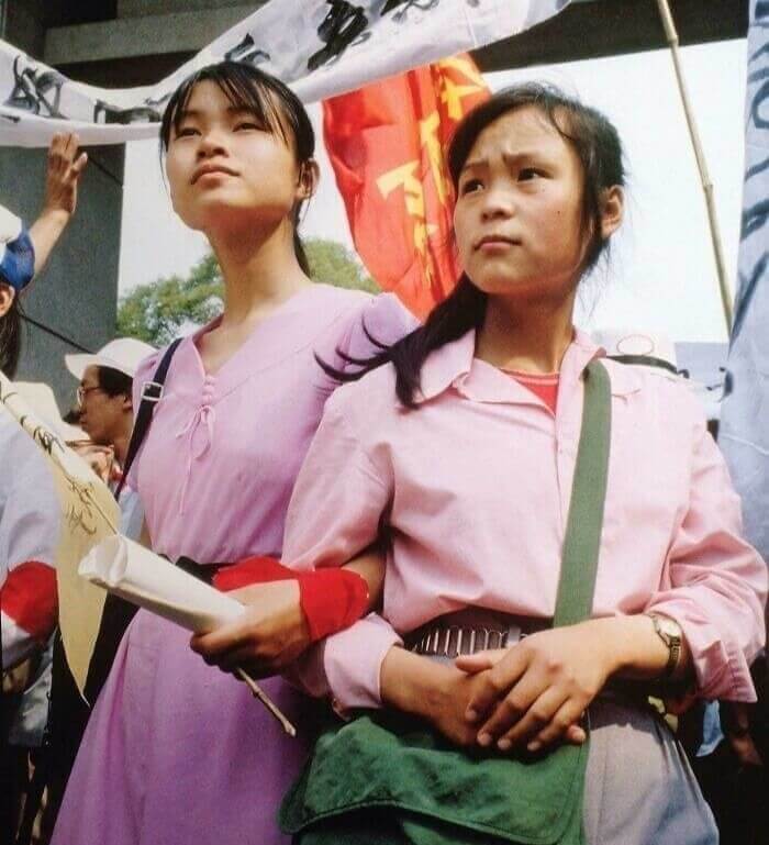 Two Young Female Students Standing At The Tiananmen Square Protest