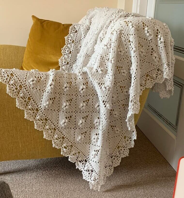 The Crochet Blanket on the Back of the Couch
