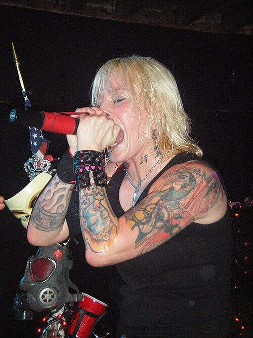 Otep Shamaya (Otep) - Poetic Spoken-Word Cadences and Nu-Metal Vocal Aggression