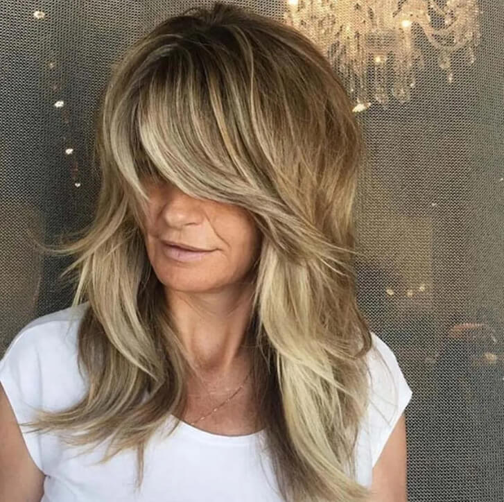 O visual emplumado da Farrah Fawcett