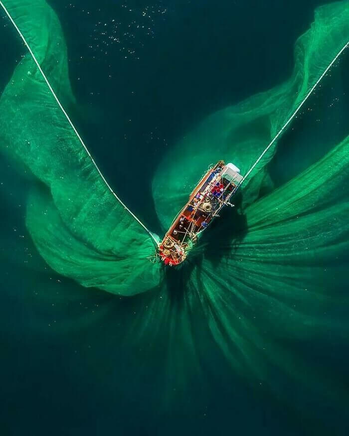 A Fishermen’s Net Spreading Out in The Vast Expanse of The Ocean