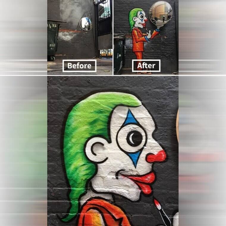 The Joker Holding a Mirror on a New York City Wall