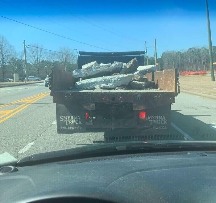 A Pickup Truck With No Doors and Loose Debris