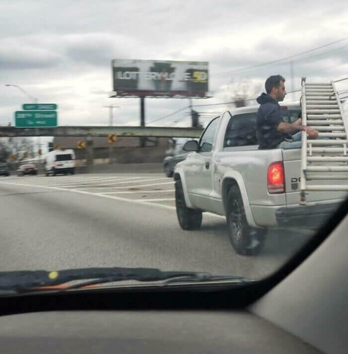 Holding the Ladder in the Back of a Pickup