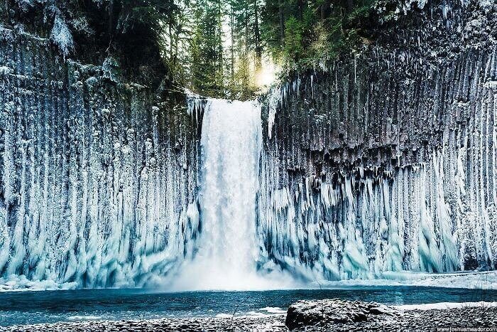 A Waterfall's Mist Got Frozen Against The Cliff