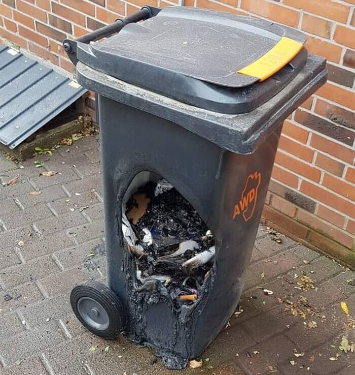 Charcoal From A Hot Grill Burned Through The Trash Can