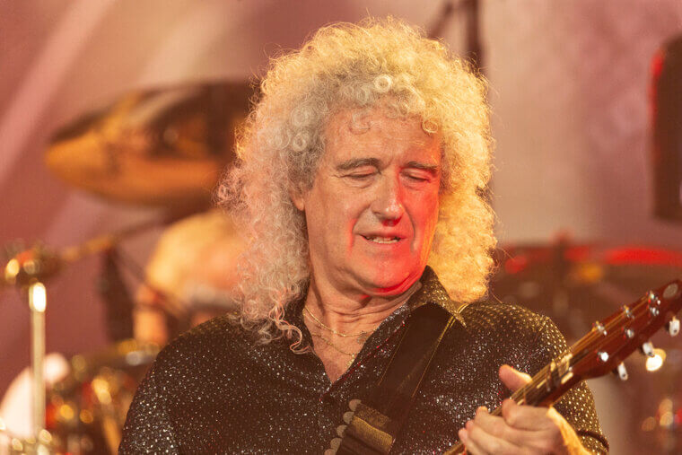 Brian May Astounds Crowds With Spectacular Guitar Solos on Tour With Queen