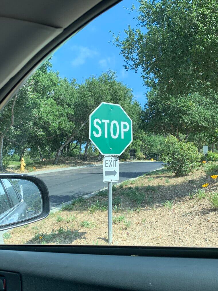 Green Stop Sign With Exit Arrow