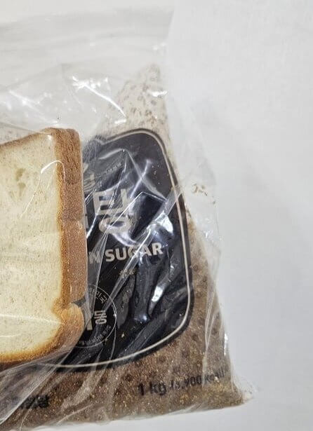Place A Slice Of Sandwich Bread In Your Brown Sugar Container To Prevent It From Hardening Into A Brick