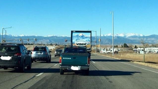 The Photo On The Truck Lines Up With The Mountains