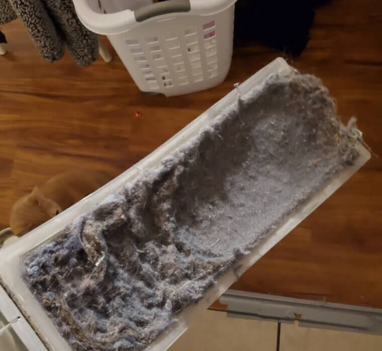 Cleaning Out Dryer Lint Traps Regularly