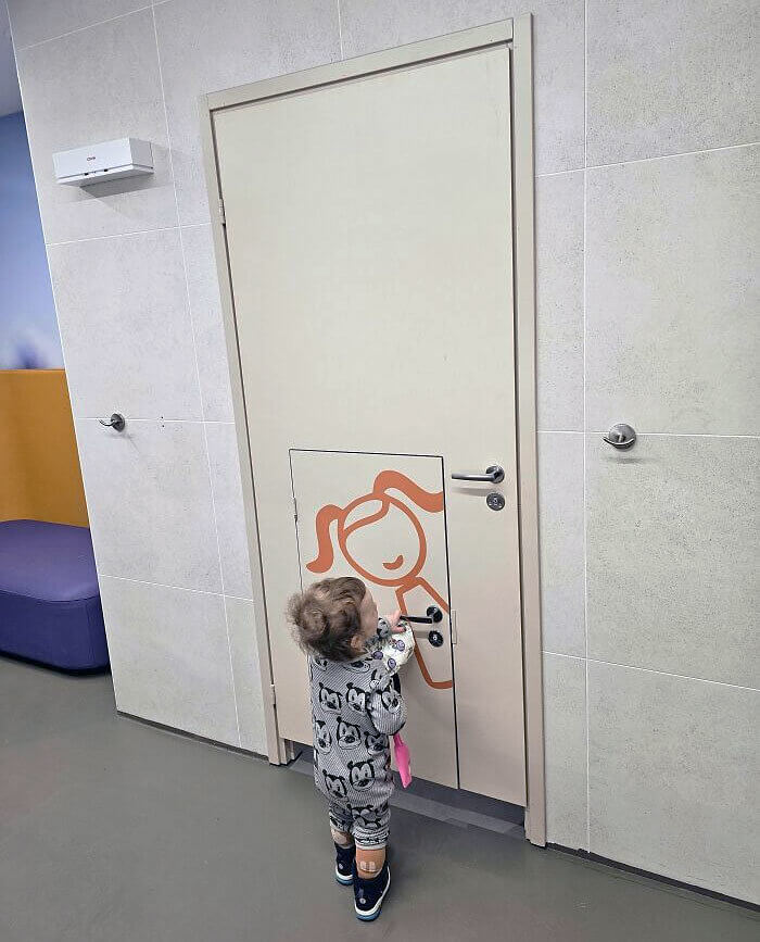 A Public Bathroom Has a Separate Smaller Door for Children