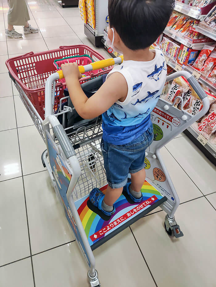 A Shopping Cart With a Standing Platform for Kids to Enjoy