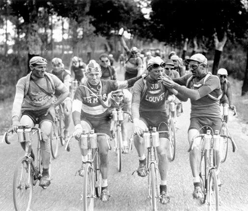 Athletes Sharing a Cig During a Tour De France