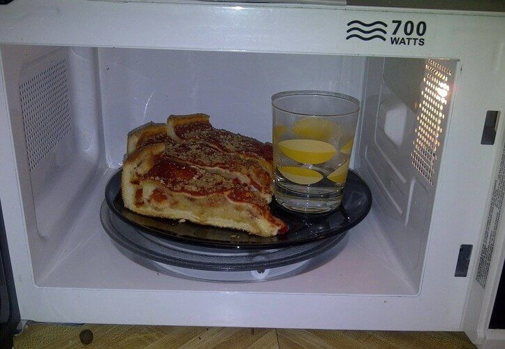 Keep Reheated Pizza Moist by Placing a Glass of Water in the Microwave