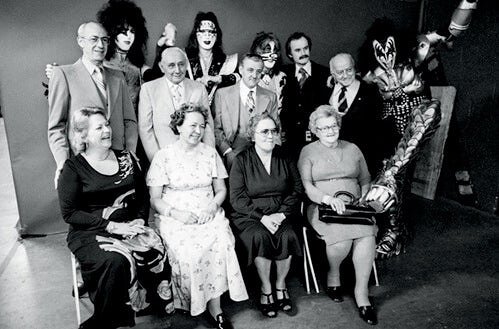 Band Members of Kiss Posing With Their Family
