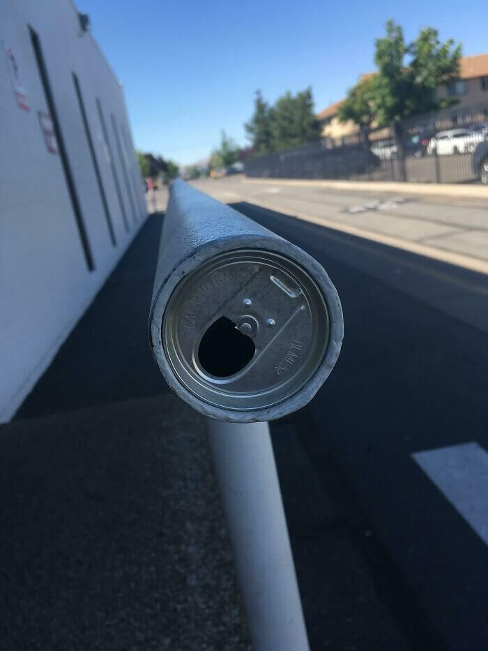 This Soda Can Inside This Railing