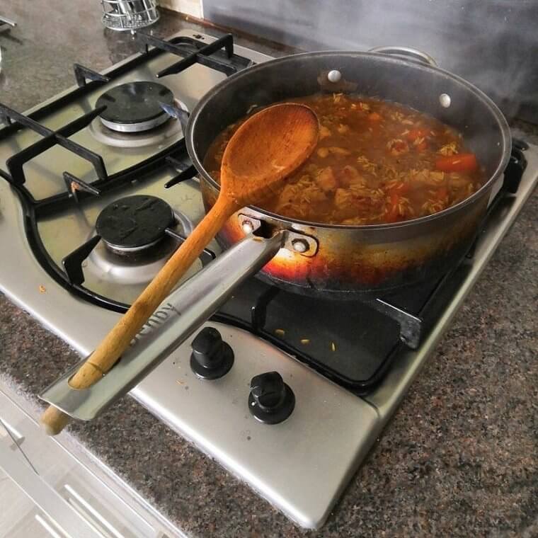 The Hole in Your Pot Handle Can Hold Your Cooking Spatula