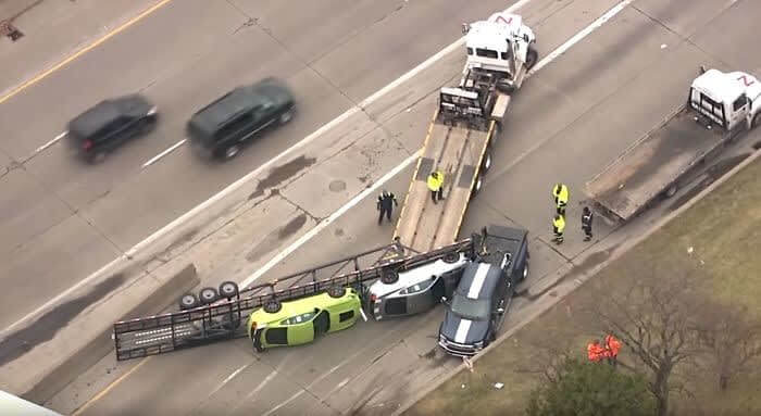 A Trailer Full Of New Cars Tipped Over In Transit