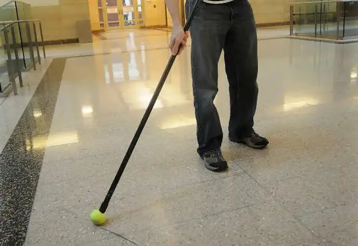 Clean Scuff Marks Using A Tennis Ball And Broomstick