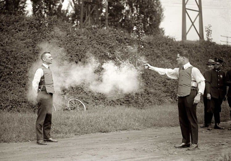 Demonstrating a New "Bulletproof Vest," 1923