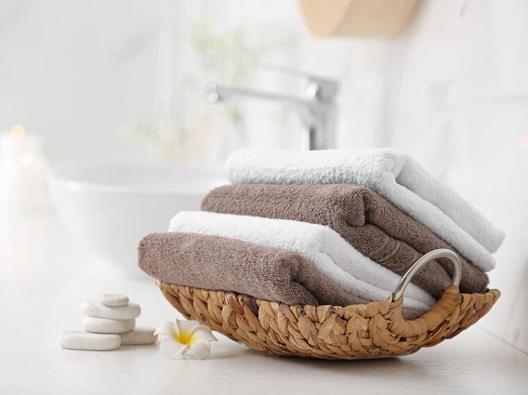 Keep Towels Organized With Wicker Baskets