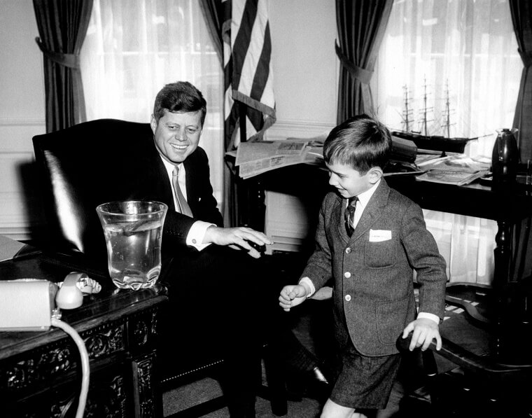 John F. Kennedy Jr. ’s Under-The-Desk Hiding Spot in the Oval Office