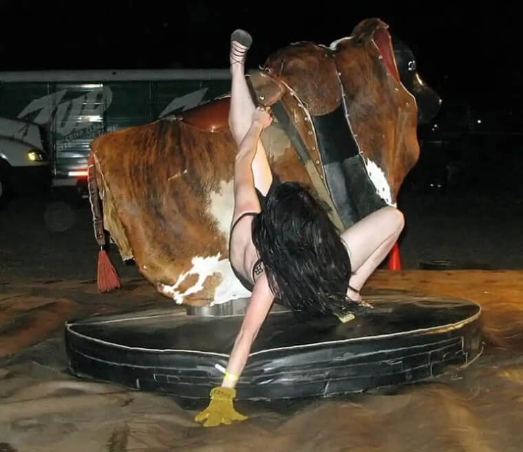 This Woman Rides a Mechanical Bull Like Her Life Depends on It