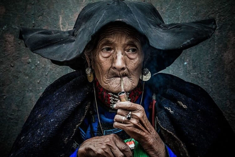 Smoking An Old Woman (Fascinating Faces And Characters Category: Remarkable Award)