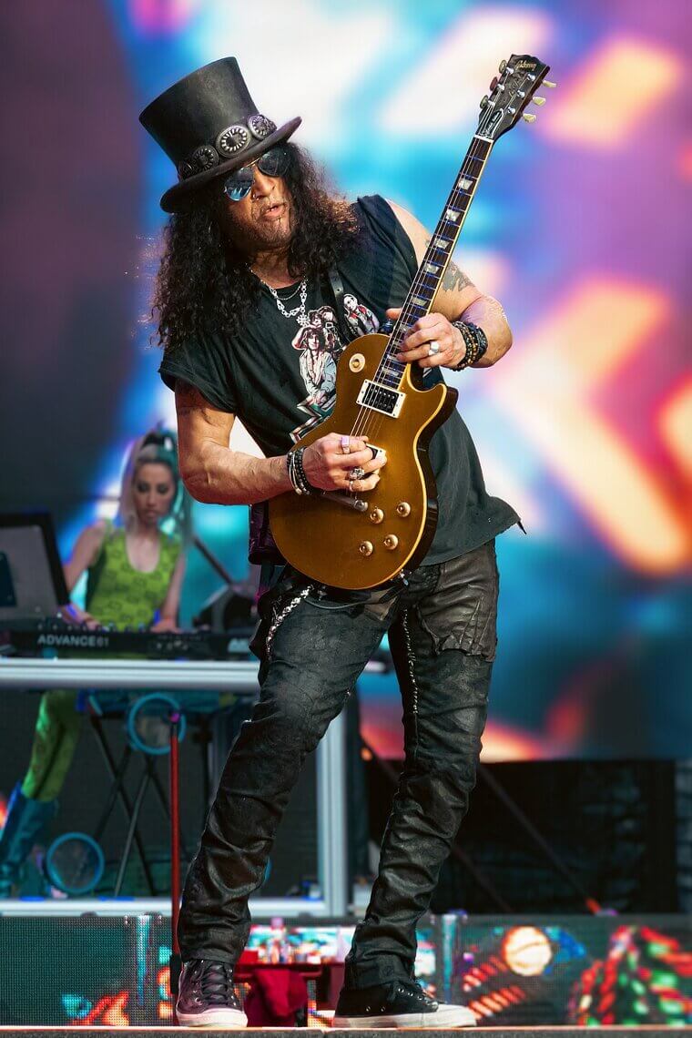 Slash Gets Tackled By A Fan While Playing A Guitar Solo