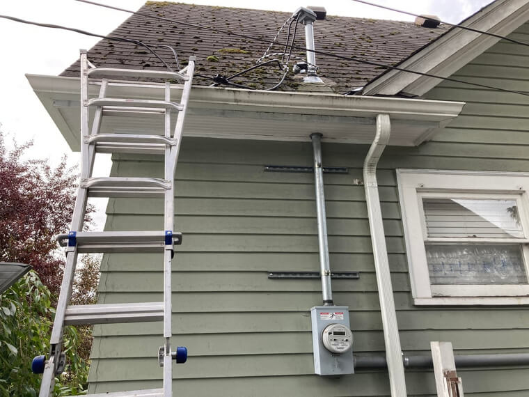 Deep Cleaning Gutters on a Two Story Home