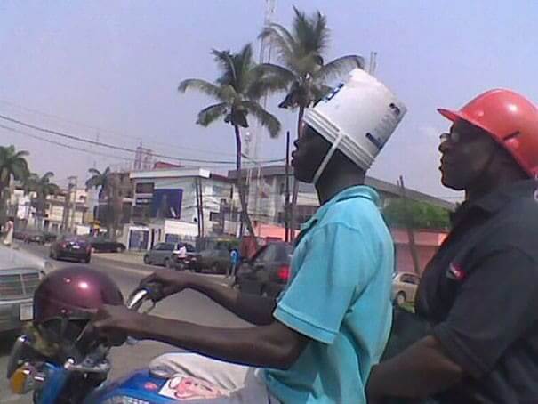 A Bucket For His Head And A Helmet For His Handle Bars