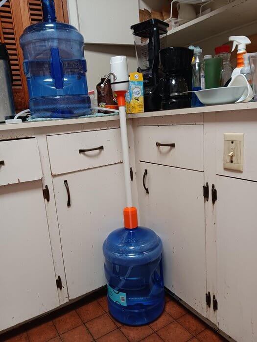 Use A Pump To Easily Lift Heavy Water Jugs