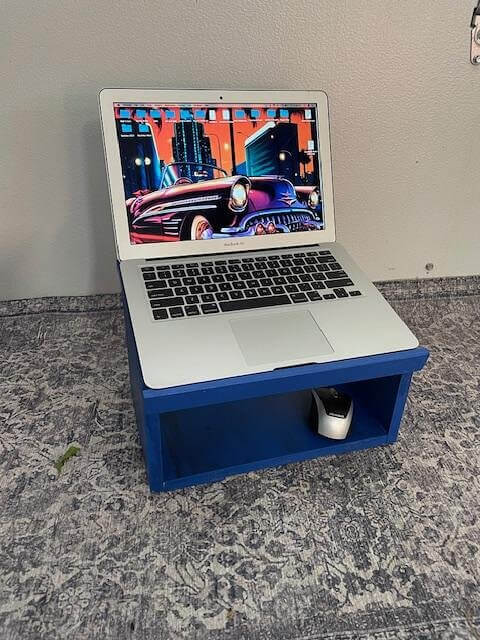 Use A Small Stand To Create A Comfortable Laptop Setup