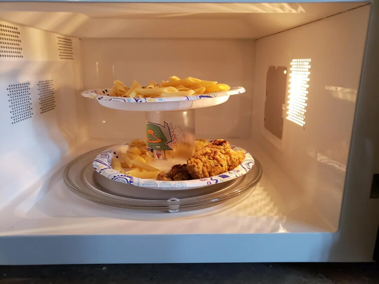 Use A Cup To Heat Two Plates In The Microwave