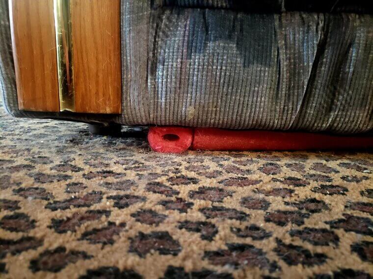 Use Pool Noodles To Stop Toys From Rolling Under Furniture