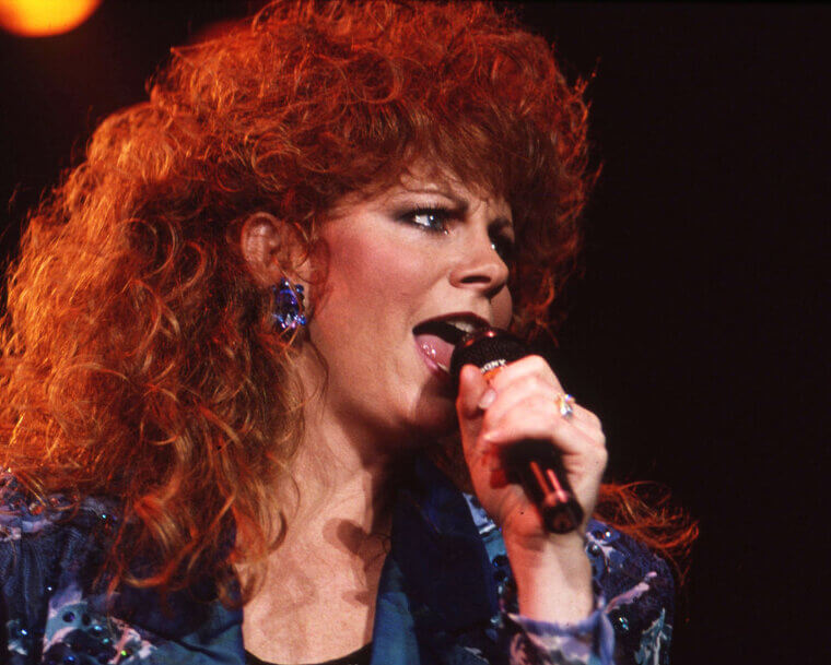 Reba McEntire's 1980s Voluminous Red Curls Required Double-Duty Hairspray