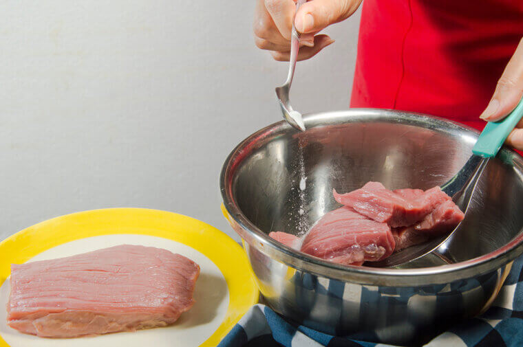 Coating Fibrous Steaks in Baking Soda and Water to Achieve a Melt-In-Your-Mouth Tender Texture