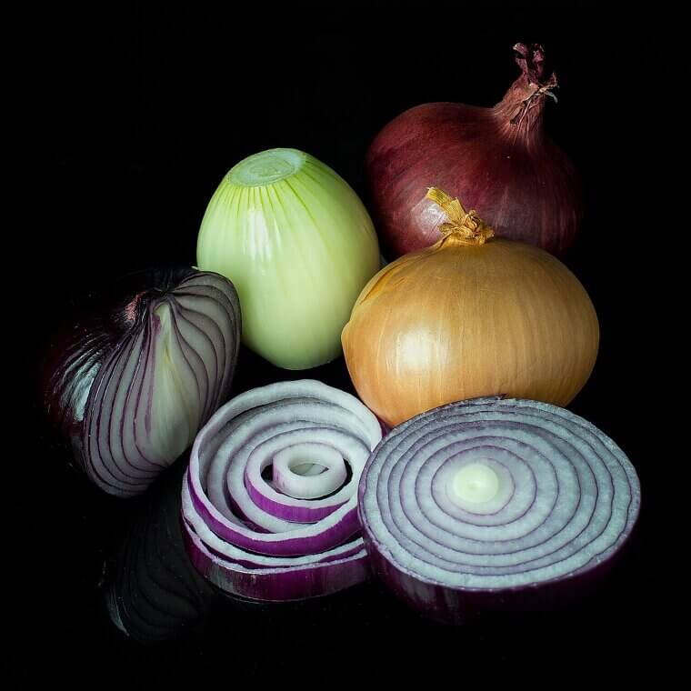 Submerging Sliced Raw Onions in Freezing Water to Tame Their Pungent Bite for Salads