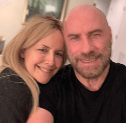 Kelly Preston Snuggling With Her Husband